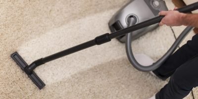 Close up of vacuuming a carpet